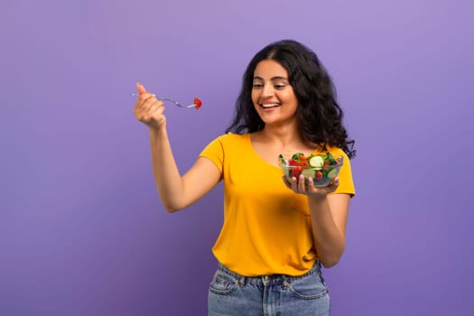 Attractive young indian woman eating healthy meal