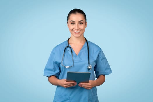 Cheerful female medical professional with tablet