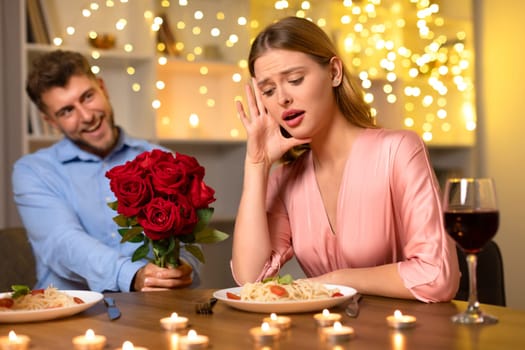 Woman shocked by surprise bouquet from man at dinner