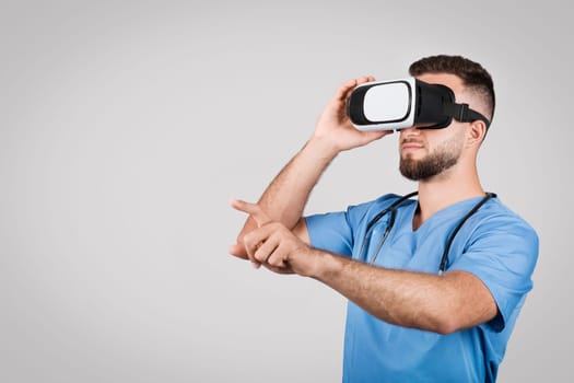 Male nurse in scrubs using VR headset for training