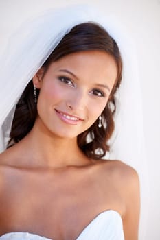 Portrait, smile and a bride at her wedding for love, marriage or an event of tradition in celebration of commitment. Face, beauty and elegance with a happy young woman getting married at a ceremony