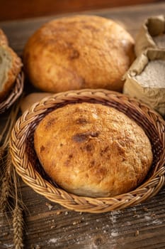 Whole fresh bread in wicker basket