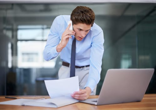Business man, phone call and reading computer, documents and paperwork for planning, accounting and financial advice. Professional worker talking on mobile and laptop information or taxes management.