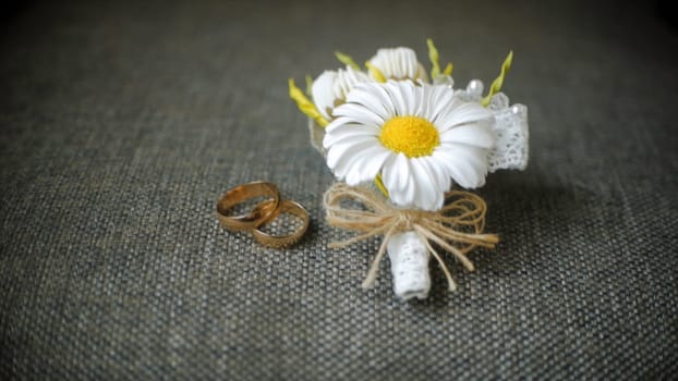 Engagement rings and wedding bouquet of flowers. Clip. Bouquet of flowers and beautiful wedding rings