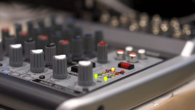 Close-up of mixing console. Stock. Close up multi color buttons of sound mixer console, shallow depth of field DOF