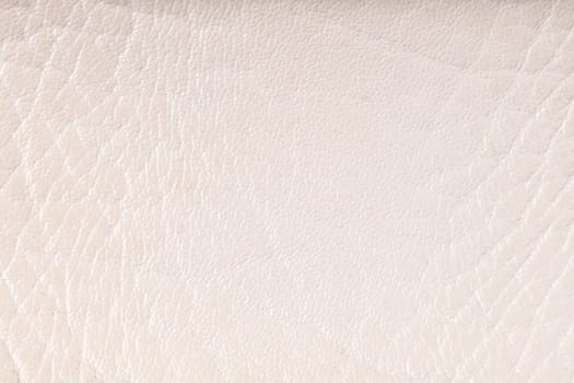 Closeup on cracked white leather texture background.
