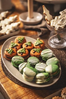 Plate with beautifully decorated Christmas macarons 