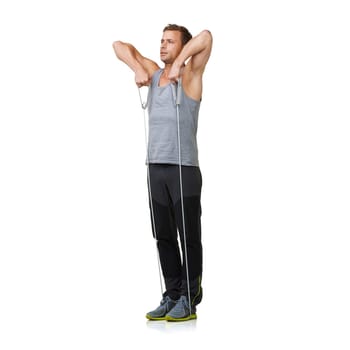 Workout, man and stretching a resistance band in studio, gym and fitness training for strong muscles. Sports person, exercise and commitment by gym equipment in mockup and cardio by white background