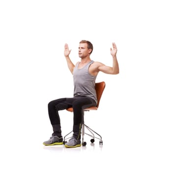 Man, stretching and hands on chair in studio for exercise, workout or posture training with concentration. Person, sportswear or physical activity with mock up space on white background and calm face