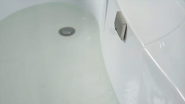 Waterfall faucet. waterfall jet with jacuzzi in action. Empty Swimming pool with waterfall jet and jacuzzi in action