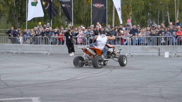 Yekaterinburg, Russia-August, 2019: Man performs tricks on a Quad bike in public. Action. Extreme Quad bike stunts