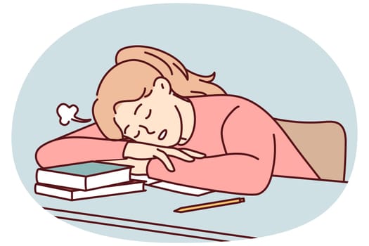 Exhausted student sleep on desk overwhelmed with studying