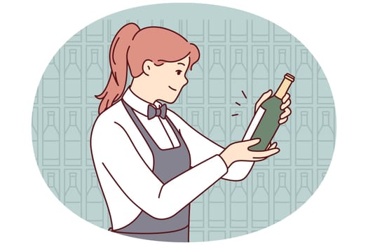 Smiling waitress choosing wine in cellar