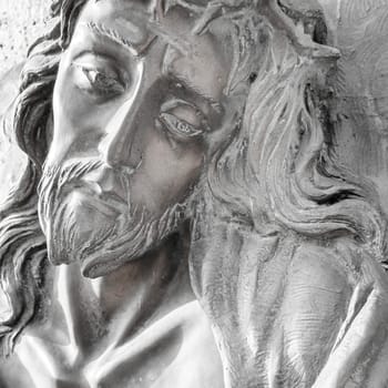 Stone Face of Jesus Christ. Portrait photo of Jesus Christ statue.