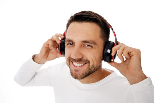 young man in headphones listening to music