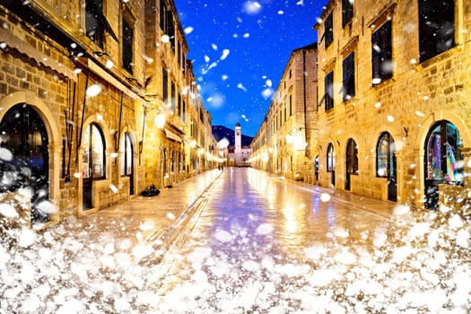Famous Stradun street in Dubrovnik night winter snow view