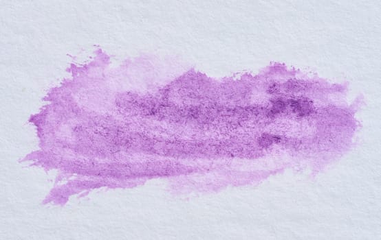 Watercolor brush stroke of violet paint on a white paper