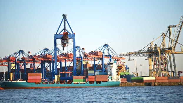 Cargo crane in sea port with containers