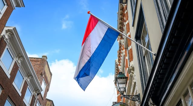 Flag in Amsterdam sky at netherlands street