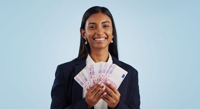 Business woman, portrait and money fan in financial freedom against a blue studio background. Happy face of female person or employee with cash, savings or investment for bonus salary on mockup space