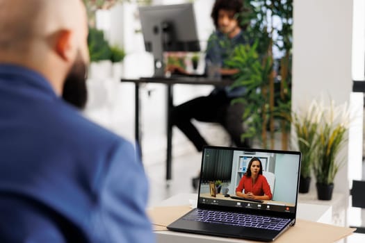 Manager discussing startup development with woman ceo in videocall