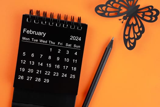 February 2024 desk calendar for the organizer to plan and reminder and butterfly paper.