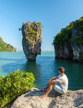 James Bond Island Phangnga Bay Thailand, Asian young man visit the Island near Phuket Thailand
