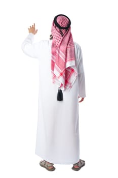 Back view of an Arab man in thobe standing on white isolated background
