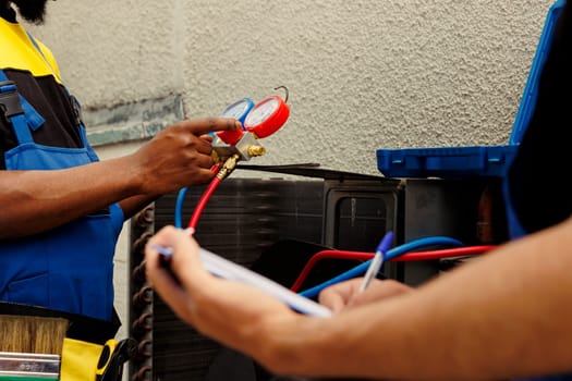 Wiremen refill HVAC system refrigerant