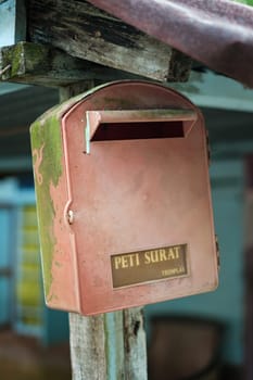 Vintage Red Mailbox with Rust