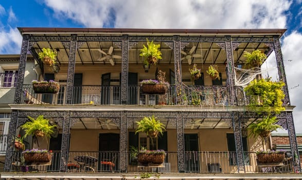 Traditional wrought iron balcony on brick New Orleans house