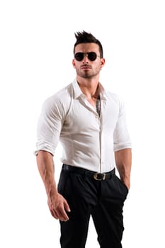 Photo of a muscular and attractive man in a white shirt and black pants