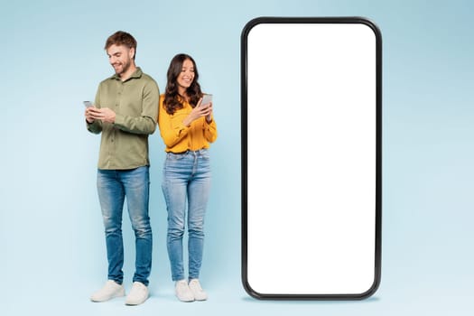 Couple with smartphones and mockup screen, ideal for app display
