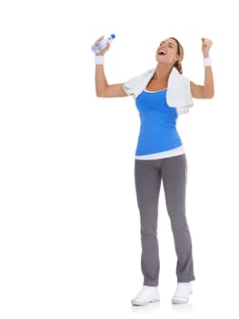 Woman, fitness success and celebration in studio with water bottle for exercise, workout success or body goals. Excited model with fist, power and yes or energy for training on a white background
