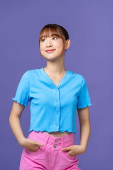 Portrait of beautiful Asian women are cool and confident in casual clothes over blue background.