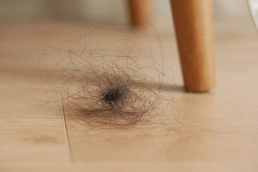 women lost hair drops on floor