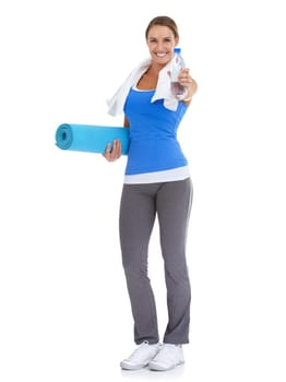 Yoga mat, water and portrait of woman in studio for exercise, training or workout. Happy, equipment and young female person with hydration drink for fitness or sports isolated by white background.