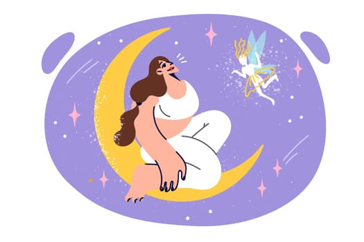 Dreaming woman sits on crescent moon in night sky and talks to fairy, seeing mesmerizing dream