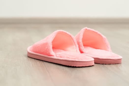 Pink home shoes on the floor