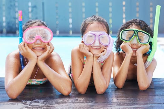 Pool, smile and portrait of children with goggles for swimming lesson, activity or hobby fun. Happy, snorkeling and girl kids with equipment for skill or tricks in water of outdoor backyard at home