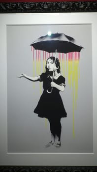 Stockholm, Sweden, December 29 2023. Art exhibition. The mystery of Banksy A genius mind. Umbrella.