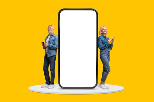 Seniors with mobiles by huge screen on yellow background