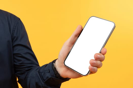 Cropped of man holding phone with white screen