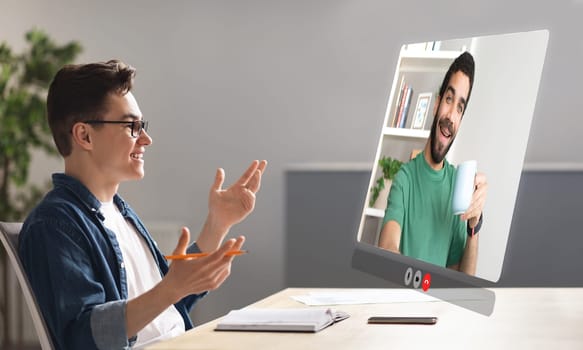 business guy immersed in virtual video meeting with coworker indoor