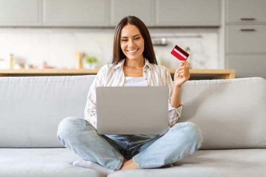 Happy Young Woman Making Online Shopping With Laptop And Credit Card