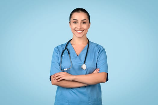 Confident woman nurse in scrubs with stethoscope