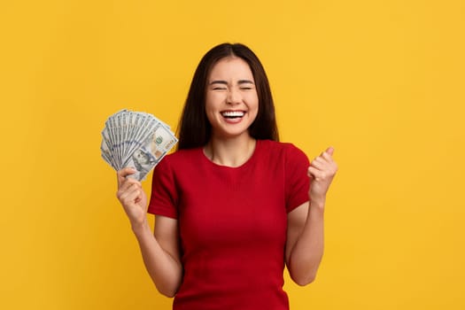 Emotional Asian Woman Holding Money Cash Grimacing And Gesturing