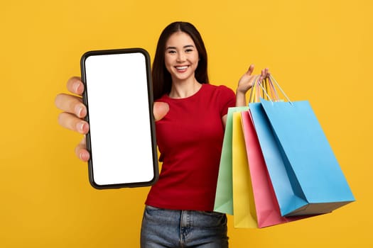 Mobile Shopping Application. Happy Asian Lady Showing Phone