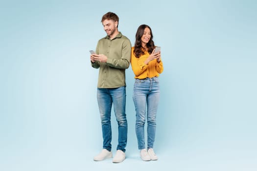Man and woman texting on phones, digitally connected side by side