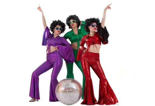 Group of girls amazed in disco style, with disco ball, halloween party, on white background.